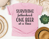 Surviving Fatherhood One Beer At A Time Grey 2 graphic tee in Blossom