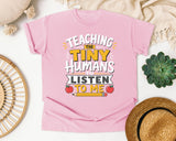 Teaching The Tiny Humans To Listen To Me graphic tee in Blossom