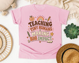 Teaching Tiny Humans Making Big Impact graphic tee in Blossom