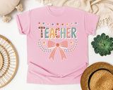 Teacher Bow Dotted Graphic Tee graphic tee in Blossom