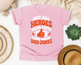 Not All Heroes Wear Capes Some Wear Dad Jokes Orange 2 graphic tee in Blossom