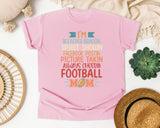 Im Bleacher Braggin Spirit Shown Football Mom graphic tee in Blossom
