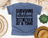 Surviving Fatherhood One Beer At A Time White graphic tee in Blue Jean
