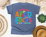 Learning ABCD Rocks graphic tee in Blue Jean