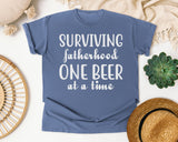 Surviving Fatherhood One Beer At A Time Classic graphic tee in Blue Jean