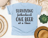 Surviving Fatherhood One Beer At A Time Grey 2 graphic tee in Chambray