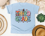 Third Grade Books Smiley Graphic Tee graphic tee in Chambray