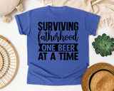 Surviving Fatherhood One Beer At A Time White graphic tee in Flo Blue