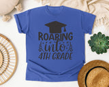 Roaring Into 4th Grade White graphic tee in Flo Blue