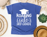 Roaring Into 3rd Grade White 2 graphic tee in Flo Blue