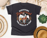 Surviving Fatherhood One Beer At A Time Brown graphic tee in Graphite