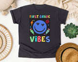 First Grade Vibes Checkered Smiley graphic tee in Graphite