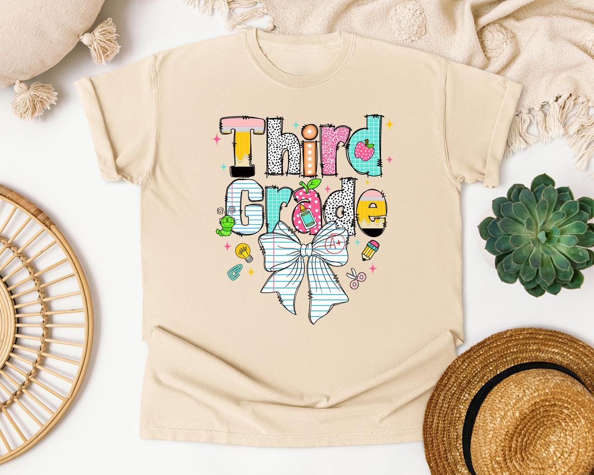 Third Grade Paper Bow graphic tee in Ivory