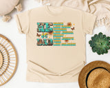 He Is Dad Brave Like David Warrior Like Joshua Teal graphic tee in Ivory