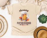 Surviving Fatherhood One Beer At A Time Brown 2 graphic tee in Ivory