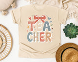 Teacher Bow Striped Graphic Tee graphic tee in Ivory