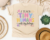 I Teach Tiny Humans With Big Feelings graphic tee in Ivory