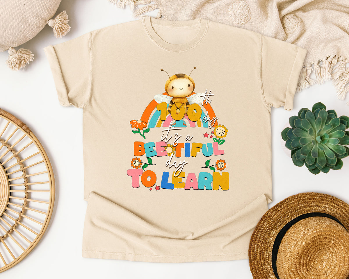 Its A Beeutiful Day To Learn 100th Day graphic tee in Ivory