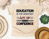 Education Is The Greatest Act Of Confidence Bold Graphic Tee graphic tee in Ivory