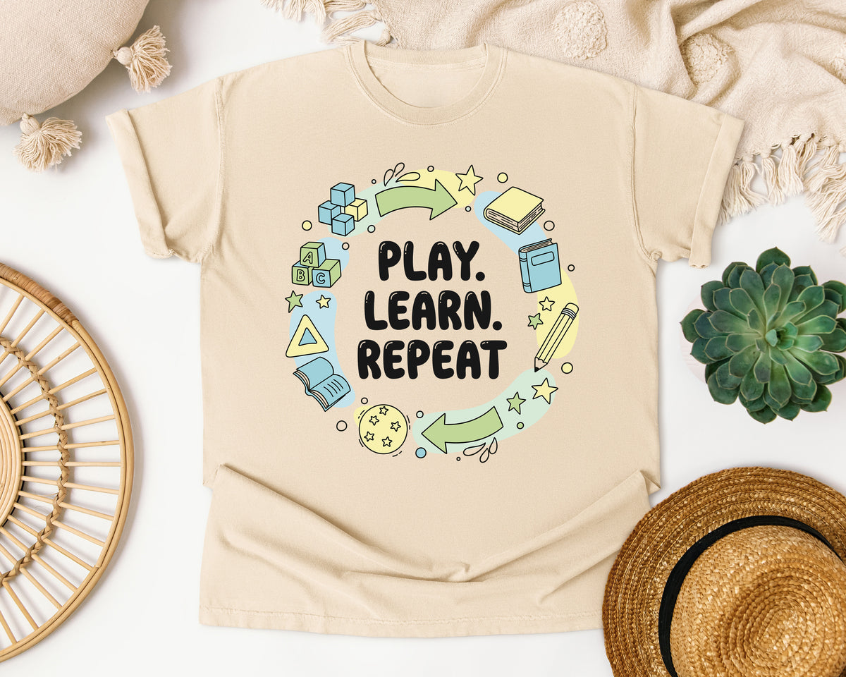 Play Learn Repeat graphic tee in Ivory