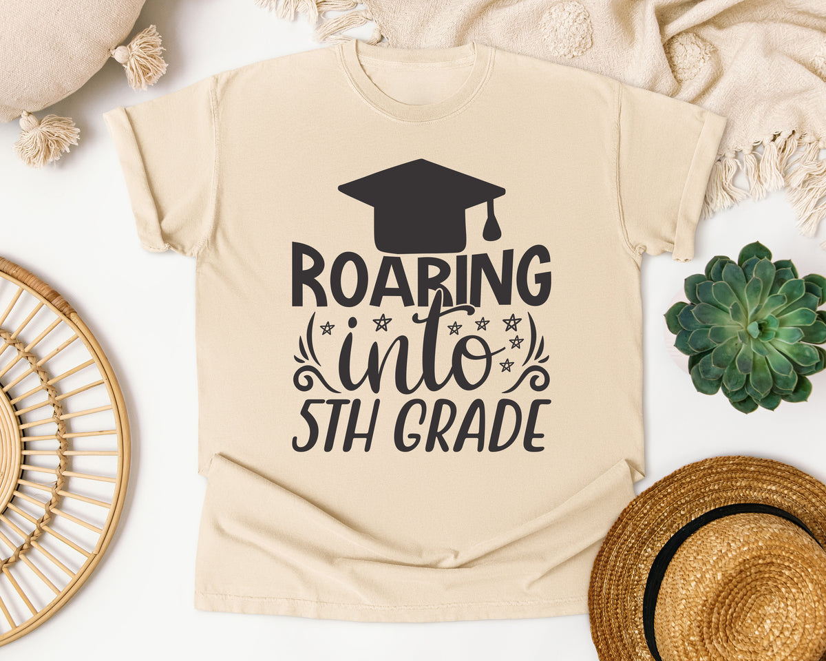 Roaring Into 5th Grade White graphic tee in Ivory