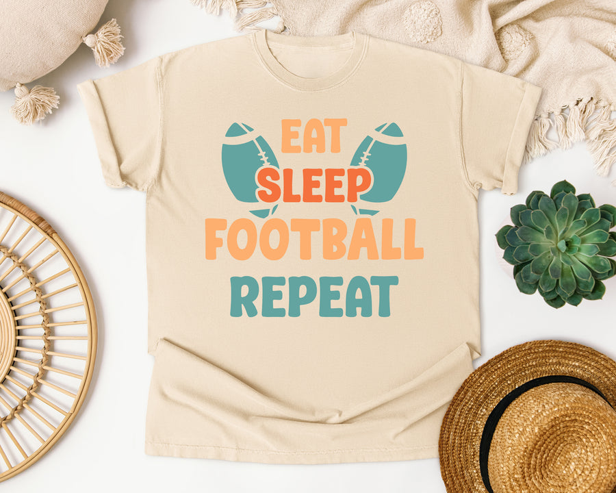 Eat Sleep Football Repeat Teal graphic tee in Ivory