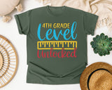 4th Grade Level Unlocked Teal graphic tee in Moss
