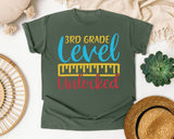 3rd Grade Level Unlocked Teal graphic tee in Moss