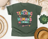 Teaching Tiny Humans Is My Superpower graphic tee in Moss
