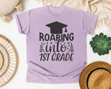 Roaring Into 1st Grade White graphic tee in Orchid