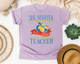 She Believed She Could Change The World So She Became A Teacher graphic tee in Orchid