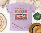 Teaching Is A Work Of Heart Flowers graphic tee in Orchid