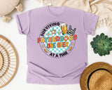 Surviving Fatherhood One Beer At A Time Grey graphic tee in Orchid