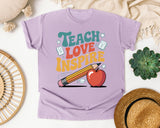 Teach Love Inspire Orange graphic tee in Orchid