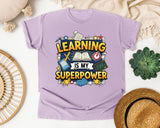 Learning Is My Superpower graphic tee in Orchid