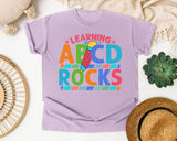 Learning ABCD Rocks graphic tee in Orchid