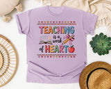 Teaching Is A Work Of Heart Grey 2 graphic tee in Orchid