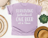 Surviving Fatherhood One Beer At A Time Classic graphic tee in Orchid