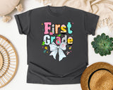 First Grade Paper Bow graphic tee in Pepper