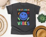 First Grade Vibes Checkered Smiley graphic tee in Pepper