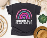 Welcome Back I'm Glad You're Here Rainbow in Graphite Comfort Colors 1717 tee