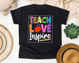 Teach Love Inspire in Black Comfort Colors 1717 tee