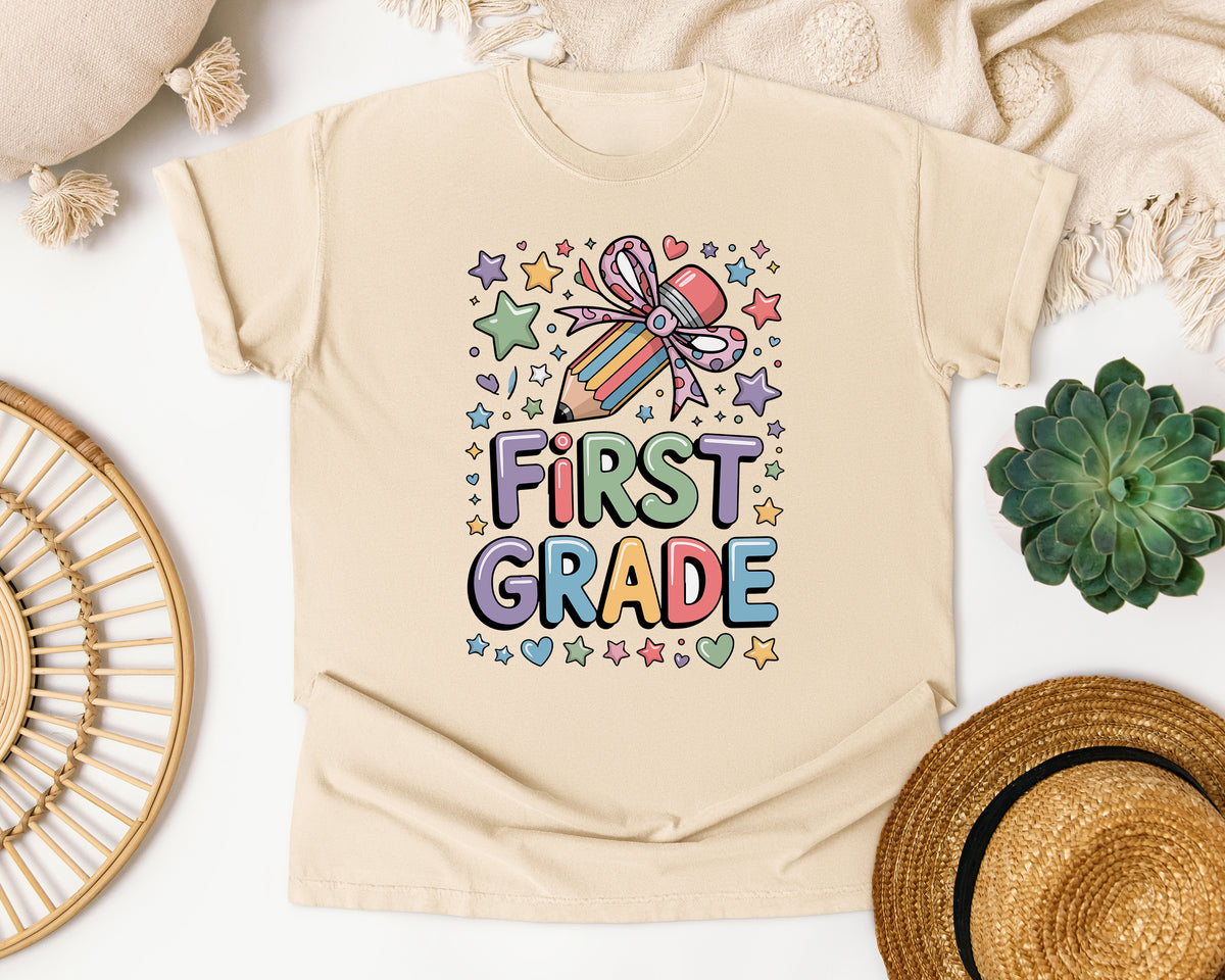 First Grade Pencil Bow Stars in Ivory Comfort Colors 1717 tee