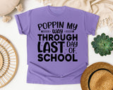 Poppin My Way Through Last Day Of School White graphic tee in Violet