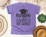 Roaring Into 1st Grade White graphic tee in Violet