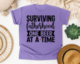 Surviving Fatherhood One Beer At A Time White graphic tee in Violet