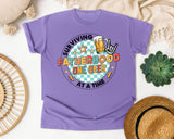 Surviving Fatherhood One Beer At A Time Grey graphic tee in Violet