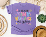 I Teach Tiny Humans With Big Feelings graphic tee in Violet