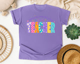 Teacher Helping Tiny Humans Do Big Things graphic tee in Violet