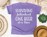 Surviving Fatherhood One Beer At A Time Classic graphic tee in Violet